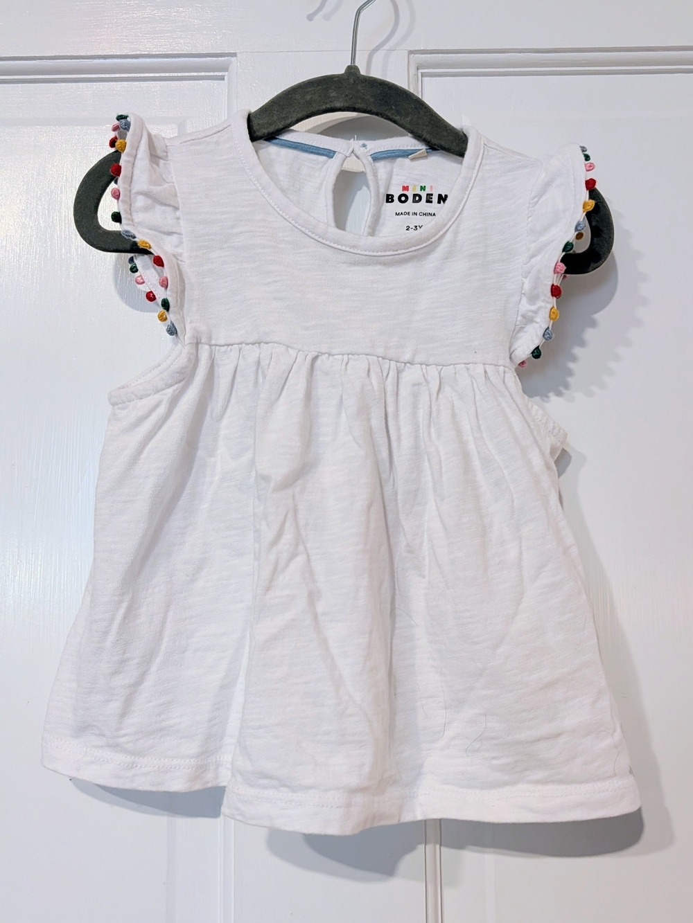 Mini Boden White Flutter Sleeve Top with Multicolor Pom Trim